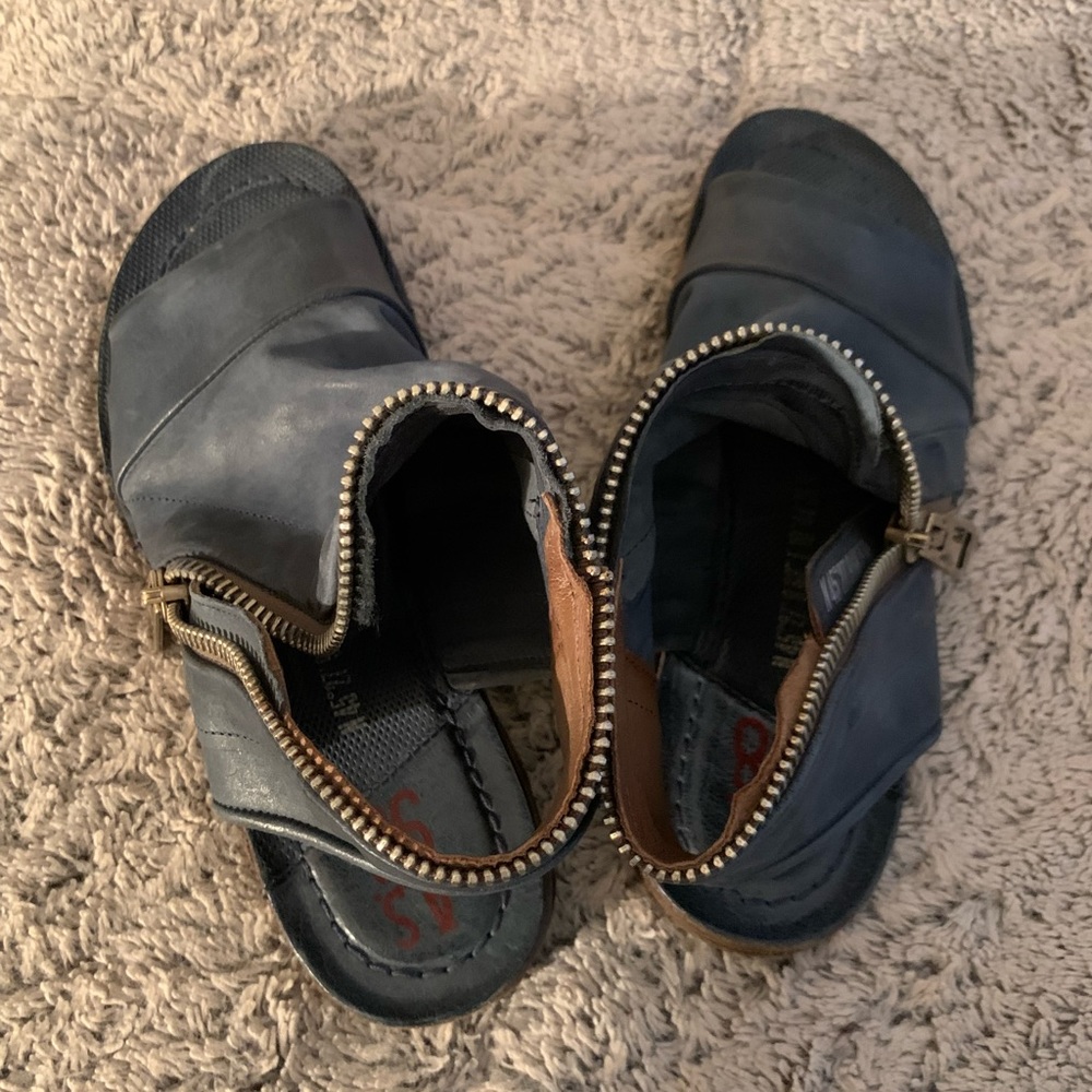 Very different sandal zips slightly around the shoe